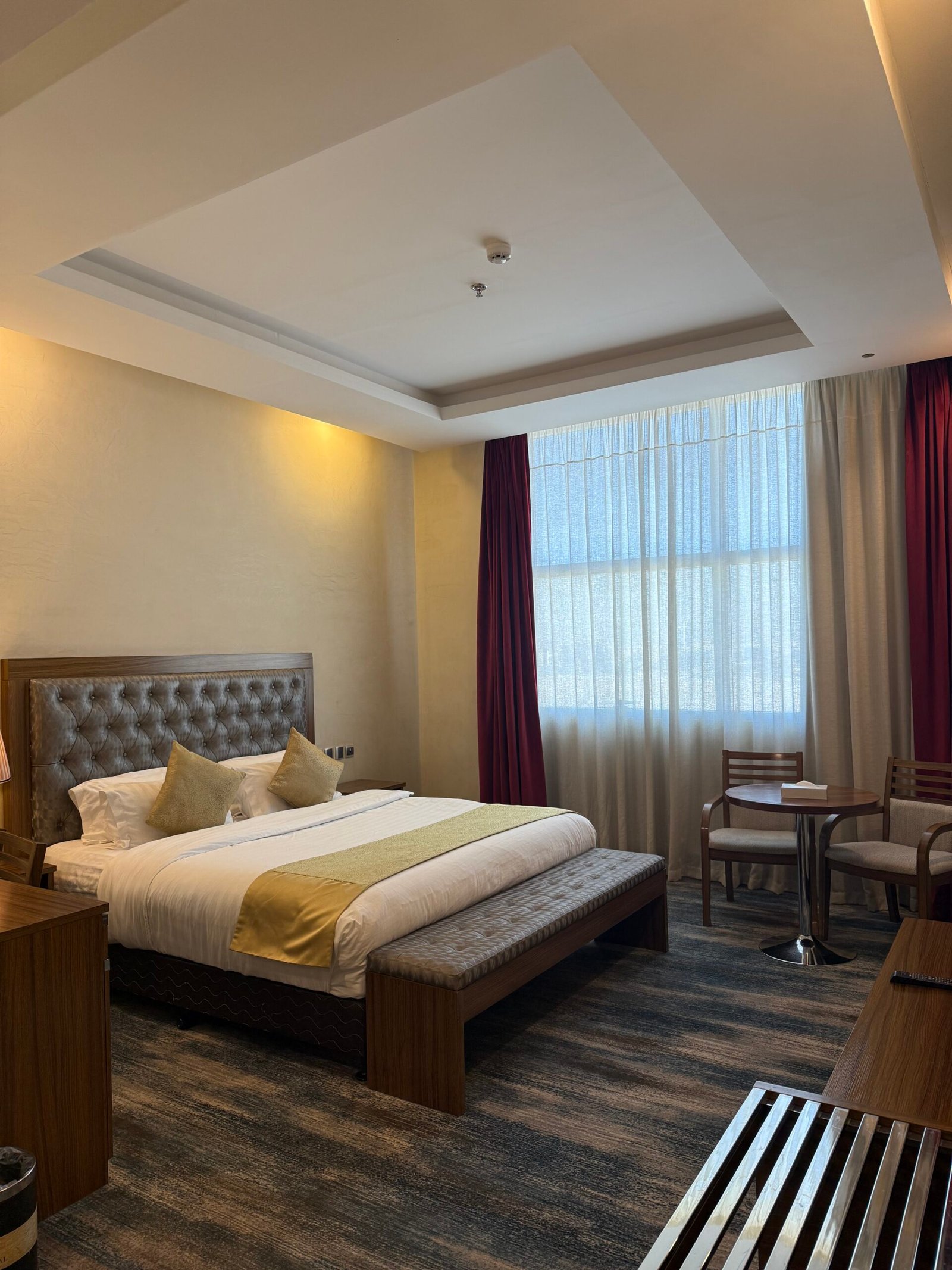 Warm, welcoming hotel bedroom